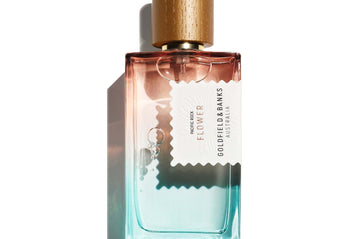 Pacific Rock Flower perfume bottle with gradient blue and pink glass and wooden cap