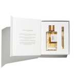 Perfume set with a bottle and a smaller vial in an open box on a white background