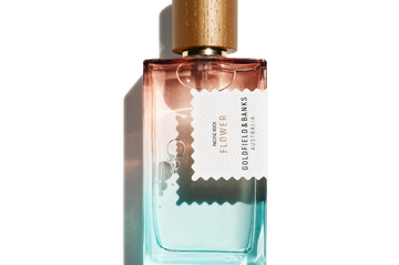 Pacific Rock Flower perfume bottle with gradient blue and pink glass and wooden cap